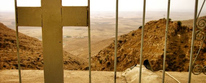 a cross in a fence at a monastery in Northern Iraq